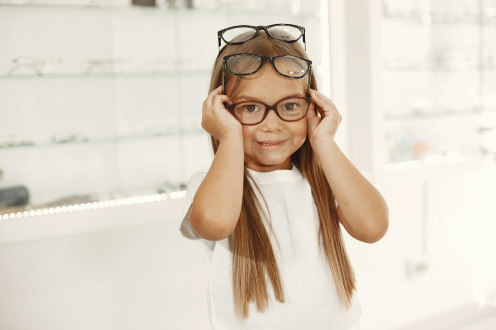 child choosing eyeglasses